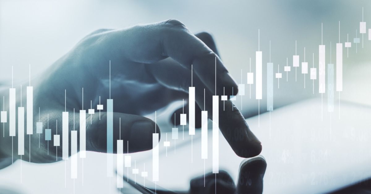 Hand touching a tablet with a data metrics overlay